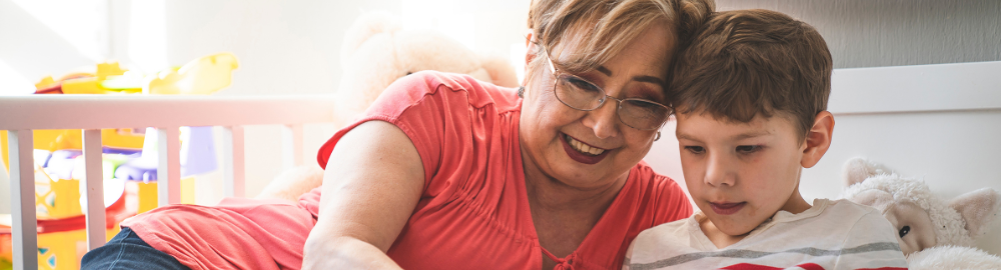 Grandmother reading to grandson